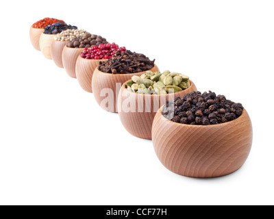 Wooden bowls full of different spices and herbs Stock Photo