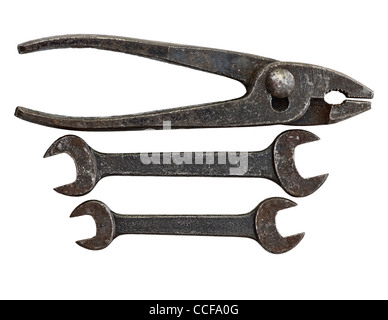 Antique tool set made up of 2 open ended spanners and a pair of pliars. Old and slightly rusted on a white background. Stock Photo