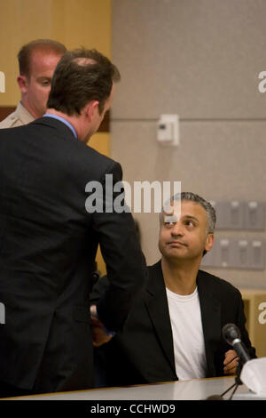 Dec. 16, 2010 - Vista, California, USA - Hollywood actor Shelley Malil (right) shakes hands with his attorney Matt Roberts at the Vista Superior Court after he was sentenced to life in prison for attempted murder after he stabbed his ex-girlfriend, Kendra Beebe 23 times in her San Marcos, California Stock Photo