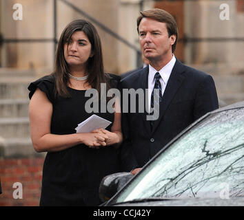 Dec 11, 2010 - Raleigh, North Carolina; USA - Former Senator JOHN EDWARDS and his daughter CATE EDWARDS look on as the casket his loaded into the hearse after the funeral service for ELIZABETH EDWARDS who passed away earlier in the week from a long battle with cancer.  The funeral service was held a Stock Photo