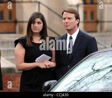 Dec 11, 2010 - Raleigh, North Carolina; USA - Former Senator JOHN EDWARDS and his daughter CATE EDWARDS look on as the casket his loaded into the hearse after the funeral service for ELIZABETH EDWARDS who passed away earlier in the week from a long battle with cancer.  The funeral service was held a Stock Photo