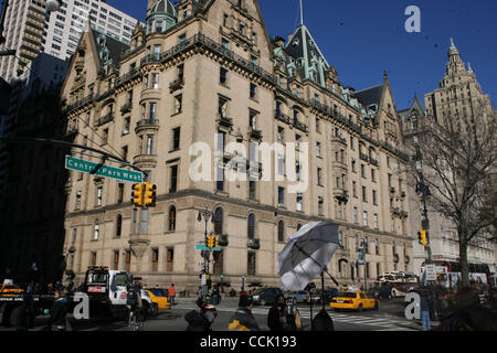 The Dakota Building at West 72nd. St. and Central Park West in Manhattan. People gathered around the Strawberry Fields in the John Lennon's 30th anniversary of his death in Central Park, Manhattan.People gather around the Strawberry Fields in the John Lennon's 30th anniversary of his death in Centra Stock Photo