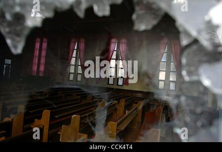 Nov 30, 2010 - Yeonpyeong Island, South Korea - The inside of a church through the broken window that was damaged in an artillery exchange between North and South Korea. Dozens of artillery shells fired by North Korea struck the island on November 23, resulting in four deaths and further injuries an Stock Photo