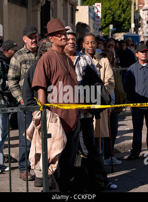 Nov. 25, 2010 - Los Angeles, California, USA - People wait in line for the Fred Jordan Mission's 67th annual Thanksgiving dinner for 2,400 poor and homeless children, women and men on skid row. Stock Photo