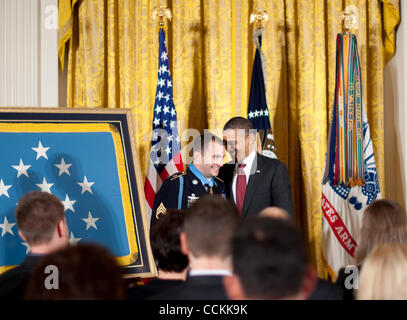 Nov 16, 2010 - Washington, District of Columbia, U.S. - President BARACK OBAMA awards the Medal of Honor to Staff Sgt. SALVATORE GIUNTA on Tuesday.  The 25-year-old Giunta was a specialist serving with the Airborne 503rd Infantry Regiment on his second tour of duty in Afghanistan when his unit was a Stock Photo