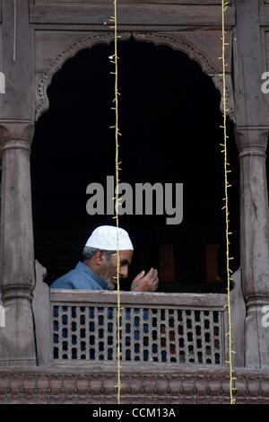 Nov 13, 2010 - Kashmir, Srinagar, India - A Kashmiri Muslim man prays inside the shrine of Shah Hamadan, on his death anniversary in Srinagar, the summer capital of Indian Kashmir. Thousands of Kashmiri Sufi Muslim devotees thronged the shrine of Saint Hamdani, who traveled to Kashmir from Iran to s Stock Photo