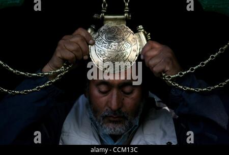 Nov 13, 2010 - Kashmir, Srinagar, India - A Kashmiri Muslim man prays entrance of Shah Hamadan shrine, on his death anniversary in Srinagar, the summer capital of Indian Kashmir. Thousands of Kashmiri Sufi Muslim devotees thronged the shrine of Saint Hamdani, who traveled to Kashmir from Iran to spr Stock Photo