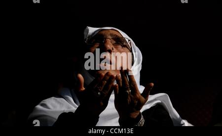 Nov 13, 2010 - Kashmir, Srinagar, India - A Kashmiri Muslim woman prays inside the shrine of Shah Hamadan, on his death anniversary in Srinagar, the summer capital of Indian Kashmir. Thousands of Kashmiri Sufi Muslim devotees thronged the shrine of Saint Hamdani, who traveled to Kashmir from Iran to Stock Photo