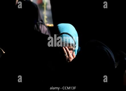 Nov 13, 2010 - Kashmir, Srinagar, India - A Kashmiri Muslim woman prays inside the shrine of Shah Hamadan, on his death anniversary in Srinagar, the summer capital of Indian Kashmir. Thousands of Kashmiri Sufi Muslim devotees thronged the shrine of Saint Hamdani, who traveled to Kashmir from Iran to Stock Photo