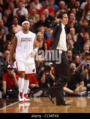 Oct. 29, 2010 - Miami, FL - Florida, USA - United States - 102910 (Damon Higgins/The Palm Beach Post) MIAMI - AMERICAN AIRLINES ARENA - Heat coach Eric Spoelstra disagrees with a call and grabs the lapel of his sportscoat during the Heat's opening home game against the Orlando Magic. (Credit Image:  Stock Photo