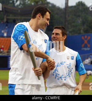 Jun 16, 2004; Los Angeles, CA, USA; WBC heavyweight boxing champion VITALI KLITSCHKO (L) shakes hands with actor TOM CRUISE after completing the Olympic Torch Relay Ceremonies inside Dodger Stadium on June 16, 2004 in Los Angeles, Ca. The global Olympic Torch Relay began the first of its four cities Stock Photo