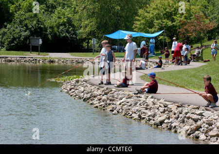 Jun 24, 2004 - Miami Township, Ohio, USA - Cub Scouts, attending summer day camp, try their hand at fishing in The Mitchell Memorial Forest Lake.  (Credit Image: © Ken Stewart/ZUMA Press) Stock Photo