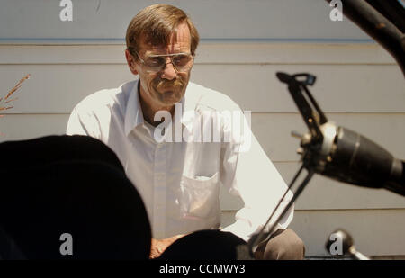 San Jose, Calif. resident Rob Kelsey sits next to his 1965 Ford Mustang Fastback in his driveway Friday, June 25, 2004, that was totalled in a joy ride by a Richmond resident. Kelsey had converted the Mustang into a Shelby Cobra R, a mint condition racing car. (Contra Costa Newspapers/Joanna Jhanda) Stock Photo