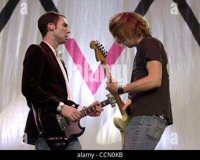 Adam Levine, vocals and guitar, left, and James Valentine on guitar of the band Maroon 5 perform at the Shoreline Amphitheatre, Friday, July 16, 2004, in Mountain View, Calif.(Contra Costa Times/Susan Tripp Pollard) Stock Photo