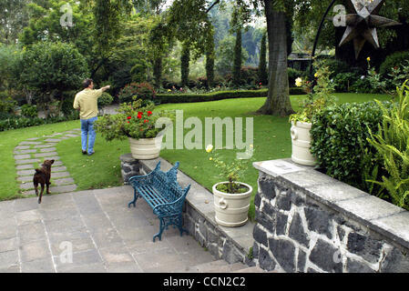 Tony Garza, US Ambassador to Mexico, plays fetch with his labradors in the backyard of the Ambassador's residence in Mexico City on the evening of Thursday July 29, 2004.  (Photo By Sarah Martone) Stock Photo