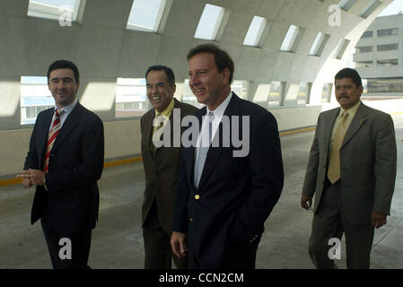 Tony Garza, US Ambassador to Mexico, (right) exits a business breakfast with members of the Businessmen Against Smuggling Coalition, on his way to the Embassy on the morning of Thursday July 29, 2004.  (Security personnel behind him)  (Photo By Sarah Martone) Stock Photo