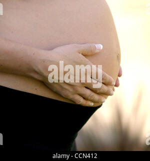 Aug 07, 2004; Los Angeles, CA, USA; A pregnant woman's stomach. Stock Photo