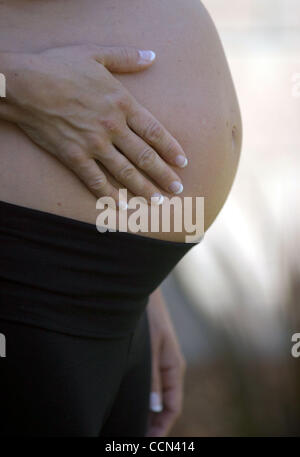 Aug 07, 2004; Los Angeles, CA, USA; A pregnant woman's stomach. Stock Photo