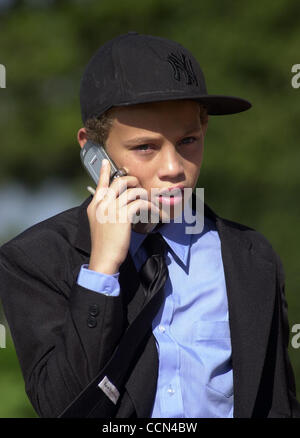 Tazman James, 12, the son of Rick James, waits outside the chapel at