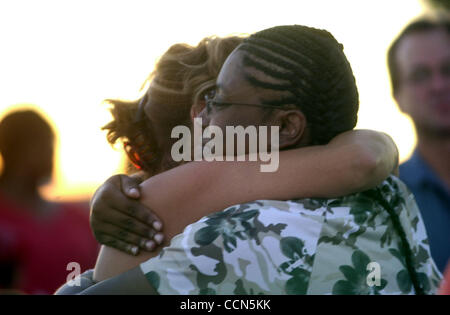 Sheila Washington (cq), the mother of Ariana Williams, is comforted by a friend during a candlelight vigil at Freedom High School in Oakley, Calif. on Saturday August 7, 2004. Ariana died of heart failure at soccer practice earlier in the week. (Sherry LaVars/Times) Stock Photo