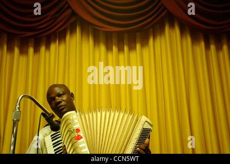 Aug 17, 2004; Miami, FL, USA; Haitian Jude Cesaire provides music as the congregation sings together during a revival service at the Haitian Baptist Church of the Living God in the Little Haiti neighborhood of Miami, FL on Tuesday, August 17, 2004. Stock Photo