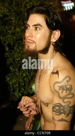 Aug 29, 2004; Miami, FL, USA; EXCLUSIVE! Guitarist DAVE NAVARRO seen holding hands with wife Carmen Electra as they leave a party on Miami Beach, Florida. The National Hotel on South Beach hosted the Ocean Drive Magazine party after the MTV Video Music Awards. Mandatory Credit: Photo by Mike Fuentes Stock Photo