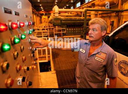 Sep 04, 2004; West Palm Beach, FL, USA;  Hurricane Frances- GARY FISCHER of the South Florida Water Management District checks gauges monitoring the emergency generators at the S-5A pumping station near 20-mile bend. The pump station sits idle as the first feeder bands passed through Palm Beach Coun Stock Photo