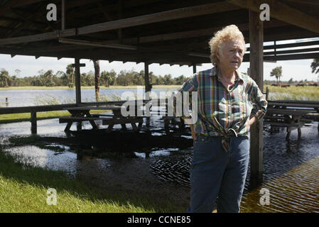 092704 tj hur jeanne e -- Staff photo by Taylor Jones/09-27-04. INDIANTOWN, FL. FOR RACHEL HARRIS' STORY. Iris Wall(cq), 75, stands under a pavilion on her flooded 1,200 acre ranch in Indiantown. Hurricane Jeanne flooded the ranch. Wall believes runoff and pumping from nearby citrus groves made it w Stock Photo