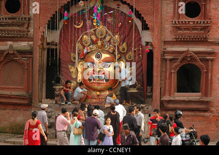 Oct 03, 2004; Basantapur Durbar Square, Kathmandu , NEPAL; Living Goddess Kumari Festival: The large facial sculpture of the god Swet Bhairab is brought out at the beginning of the Indra Jatra festival, and is left in full view for the entire ceremony. The god was originally introduced at the time o Stock Photo