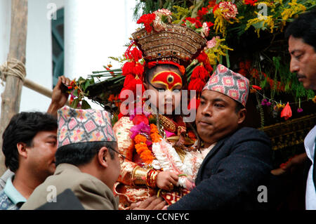 Oct 03, 2004; Basantapur Durbar Square, Kathmandu , NEPAL; Living Goddess Kumari Festival: One of the main events of the Festival of Indra Jatra is the Kumari Jatra (also called the Rath Jatra, or Chariot Festival). The primary event of the Kumari Jatra is the pulling of the three-tiered chariot bea Stock Photo