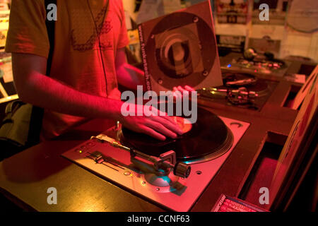 Oct 05, 2004; Leeds, UK; A DJ and record collector try out some new LP's, 45's and 78's on decks in a record store. Rare music on vinyl is collectible and becoming harder to find. Stock Photo