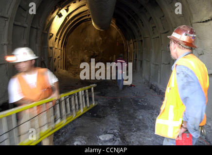 Workers clean up for a press conference to discuss construction progress at the site of the East Bay Municipal Utilities District Claremont Tunnel seismic upgrade project in Oakland, Calif., Wednesday, October 13, 2004. (Contra Costa Newspapers / Kristopher Skinner) Stock Photo