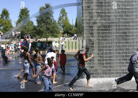 Aug 06, 2004; Chicago, IL, USA; Spanish conceptual artist Jaume Plensa's Crown Fountain at Chicago's new Millennium Park. Visitors to the park especially the children on this summer day enjoyed the fountain. Stock Photo