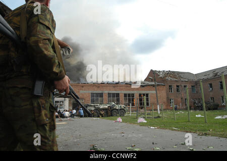 Five years on from the Beslan school siege ; pictured: soldiers rescuing school children - hostages. Stock Photo