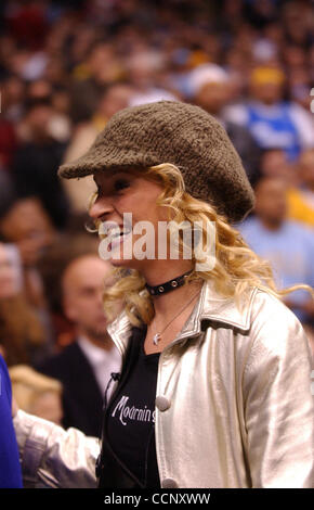 Feb 27, 2004; Los Angeles, CA, USA; Actors John Travolta, UMA THURMAN and musician Steven Tyler of 'Aerosmith' use Staples Center, during a Los Angeles Lakers game against the Sacramento Kings, as their stage while filming the sequel to 'Get Shortie' called 'Be Cool.' This is the first time John and Stock Photo