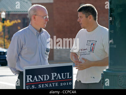 Former Rand Paul Republican Senate campaign manager DAVID ADAMS (left) talks with JOE ALEXANDER during a Tea Party rally outside the Scott County Courthouse. Adams sits on the board of the Texas-based group Americans for Fair Taxation, which released a written statement Tuesday saying Paul would sup Stock Photo