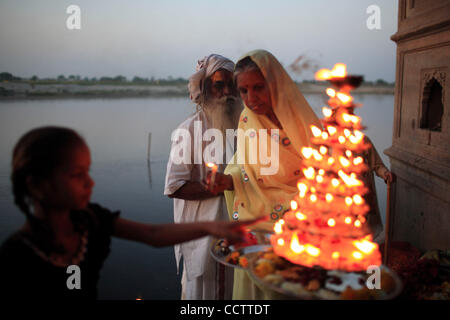 A daily  evening Aarti in praise of the Yamuna River is conducted on the ghats of the Yamuna river at Vrindavan. Stock Photo