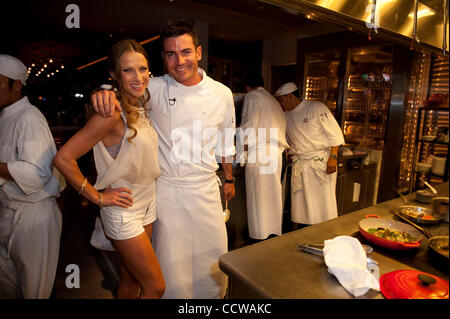 Apr. 19, 2010 - Los Angeles, CA, U.S. - professional ballroom dancer EDYTA SLIWINSKA , actor & chef AIDAN TURNER , head chef SEBASTIEN ARCHCHAMBAULT pose for a photo at AIDAN TURNER's birthday dinner. (Credit Image: © Lisa Rose/ZUMApress.com) Stock Photo