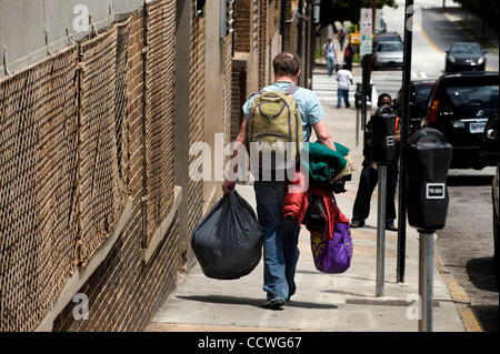 Atlanta, Georgia -- Homeless residents of the Peachtree and Pine shelter were told today that despite impending foreclosure on the 100,000 square-foot shelter, Atlanta's Task Force for the city's ever-increasing homeless situation hopes to keep it open -- somehow.    Task force leaders announced dur Stock Photo