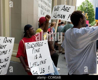 Atlanta, Georgia -- Homeless residents of the Peachtree and Pine shelter were told today that despite impending foreclosure on the 100,000 square-foot shelter, Atlanta's Task Force for the city's ever-increasing homeless situation hopes to keep it open -- somehow.    Task force leaders announced dur Stock Photo