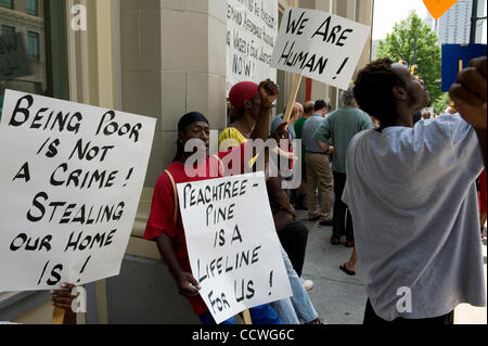 Atlanta, Georgia -- Homeless residents of the Peachtree and Pine shelter were told today that despite impending foreclosure on the 100,000 square-foot shelter, Atlanta's Task Force for the city's ever-increasing homeless situation hopes to keep it open -- somehow.    Task force leaders announced dur Stock Photo