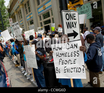 Atlanta, Georgia -- Homeless residents of the Peachtree and Pine shelter were told today that despite impending foreclosure on the 100,000 square-foot shelter, Atlanta's Task Force for the city's ever-increasing homeless situation hopes to keep it open -- somehow.    Task force leaders announced dur Stock Photo