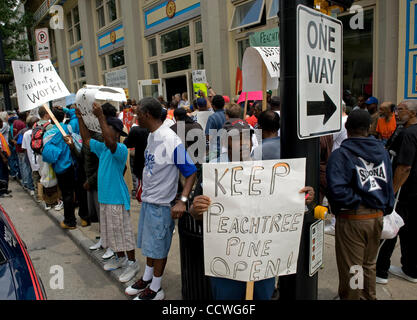 Atlanta, Georgia -- Homeless residents of the Peachtree and Pine shelter were told today that despite impending foreclosure on the 100,000 square-foot shelter, Atlanta's Task Force for the city's ever-increasing homeless situation hopes to keep it open -- somehow.    Task force leaders announced dur Stock Photo