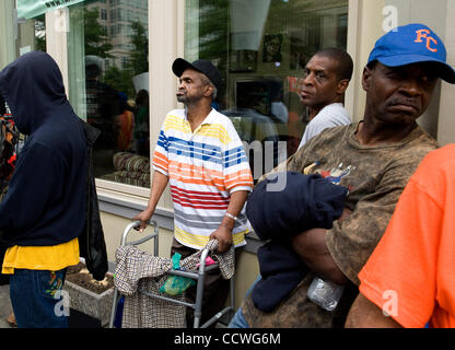 Atlanta, Georgia -- Homeless residents of the Peachtree and Pine shelter were told today that despite impending foreclosure on the 100,000 square-foot shelter, Atlanta's Task Force for the city's ever-increasing homeless situation hopes to keep it open -- somehow.    Task force leaders announced dur Stock Photo