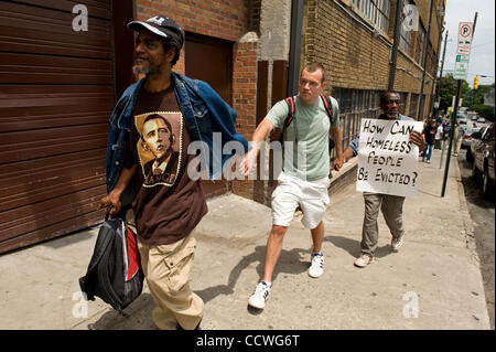 Atlanta, Georgia -- Homeless residents of the Peachtree and Pine shelter were told today that despite impending foreclosure on the 100,000 square-foot shelter, Atlanta's Task Force for the city's ever-increasing homeless situation hopes to keep it open -- somehow.    Task force leaders announced dur Stock Photo