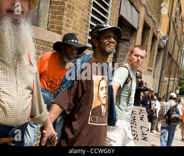 Atlanta, Georgia -- Homeless residents of the Peachtree and Pine shelter were told today that despite impending foreclosure on the 100,000 square-foot shelter, Atlanta's Task Force for the city's ever-increasing homeless situation hopes to keep it open -- somehow.    Task force leaders announced dur Stock Photo