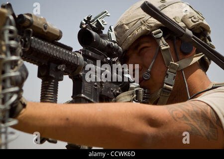 May 26, 2010 - Badghis Province, Afghanistan – Sgt. Arturo Alvarez, of 3rd Platoon, Bravo Battery, 2nd Battalion, 321st Field Artillery, 4th Brigade Combat Team, 82nd Airborne Division, returns fire during a firefight at Observation Post Barracuda near Bala Murghab in Badghis Province, Afghanistan,  Stock Photo