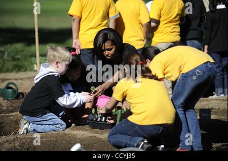 Mar. 31, 2010 - Washington, District of Columbia, U.S. First Lady MICHELLE OBAMA welcomes local area school children to the White House to help her plant her second annual  vegetable garden on the South Lawn. (Credit Image: © Christy Bowe/Globe Photos/ZUMApress.com) Stock Photo