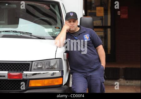 Apr 09, 2010 - Manhattan, New York, USA - 14 year veteran Paramedic Eddie Moore following the first half of a double-shift, he bussed an injured police officer to St. Vincent's at 9:57 a.m. As of 10 a.m. this morning the Fire Department has stopped sending ambulances to St. Vincent's Catholic Medica Stock Photo