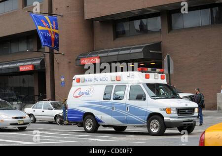 Apr 09, 2010 - Manhattan, New York, USA - An ambulance speeds down Seventh Avenue past St. Vincent's Catholic Medical Center. As of 10 a.m. this morning the Fire Department has stopped sending ambulances to St. Vincent's Catholic Medical Center in Greenwich Village. The debt-ridden hospital is slate Stock Photo